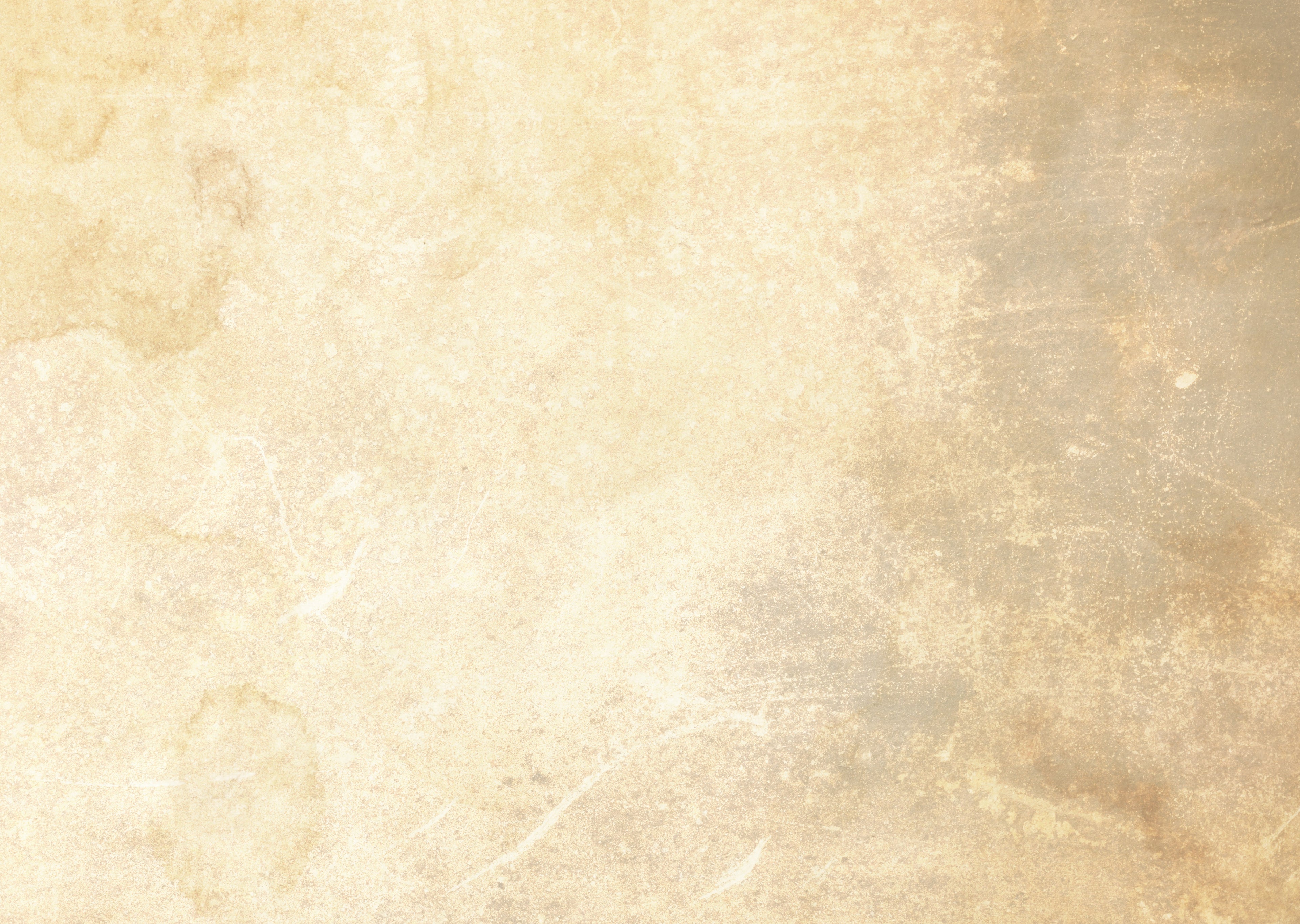 A textured beige and cream surface with a mottled, distressed pattern and subtle grayish-brown shading on the right side.
