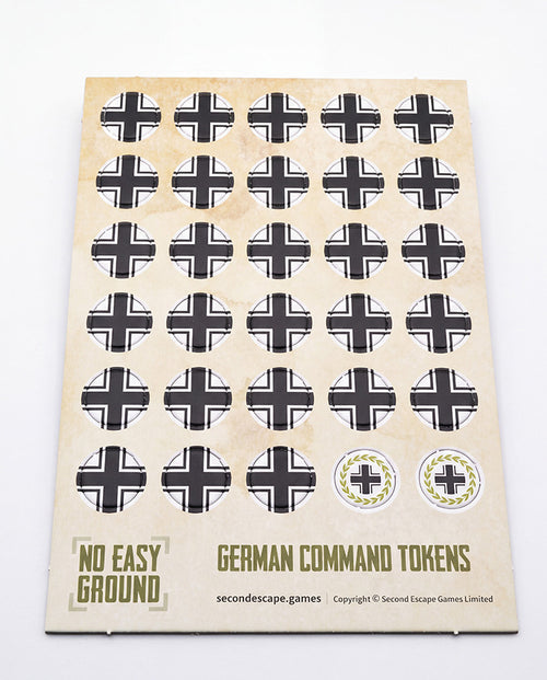 A sheet of vintage German Command Tokens for board games, featuring black and white iron crosses on a beige backing card with 'German Command Tokens' printed at the bottom.